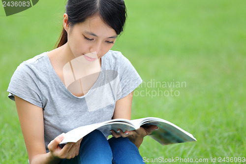 Image of Asian woman reading book