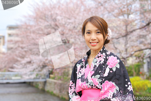 Image of Japanese woman wearing kimono with cherry blossom