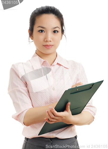 Image of Asian business woman write on file pad