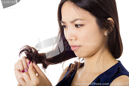 Image of Asian woman with hair problem