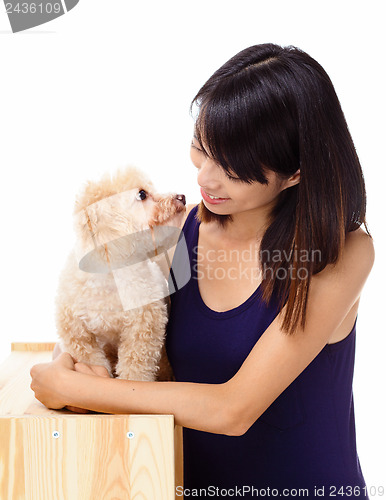 Image of Asian woman with poodle