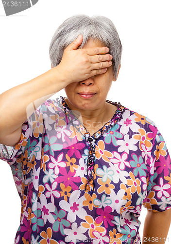 Image of Mature asian woman feel headache