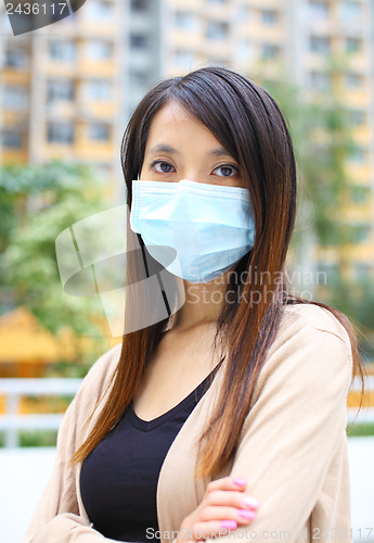 Image of Asian woman wearing face mask