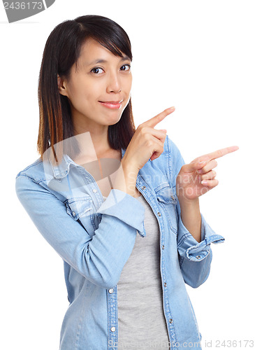 Image of Asian woman pointing a side