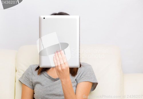 Image of Asian woman using tablet