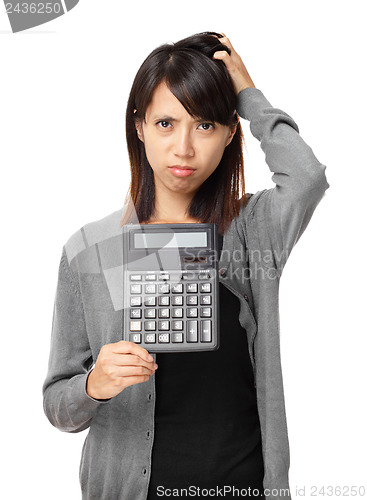 Image of Asian woman holding calculator 