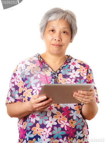 Image of Asian old woman with digital tablet
