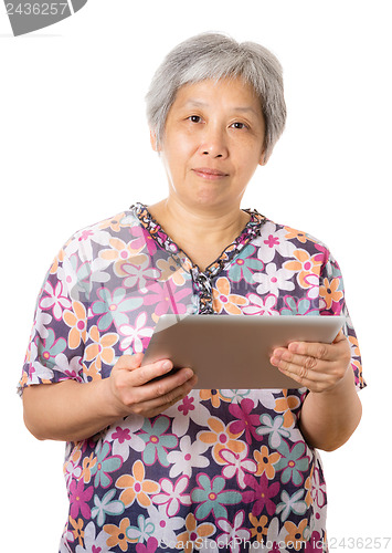 Image of Asian old woman using digital tablet