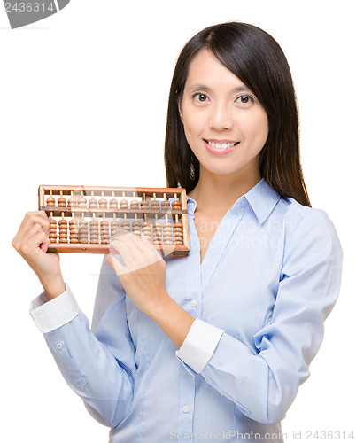 Image of Asian woman holding abacus