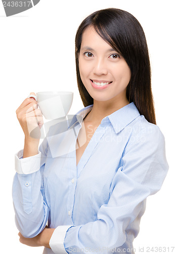 Image of Asian business woman holding a cup of coffee