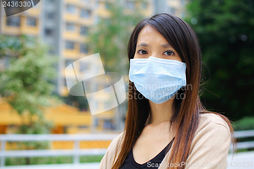 Image of Asian woman wear protective face mask