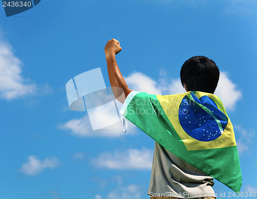 Image of Brazil supporter hand up