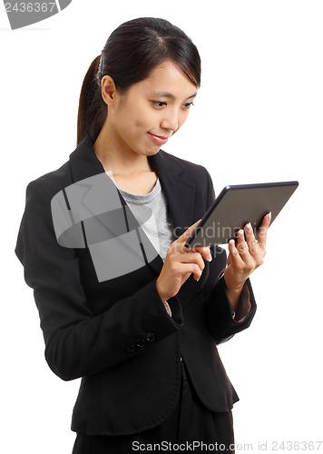 Image of Asian business woman using tablet pc