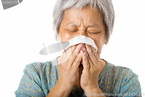 Image of Asian old woman sneezing