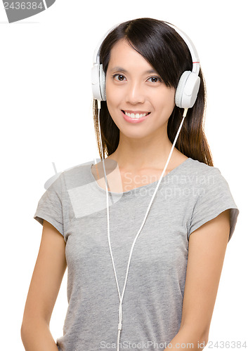 Image of Asian woman using headphone