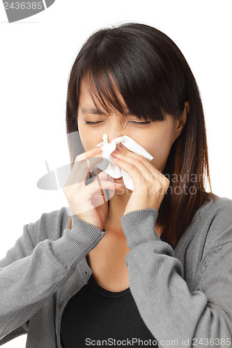 Image of Cold sneezing asian woman