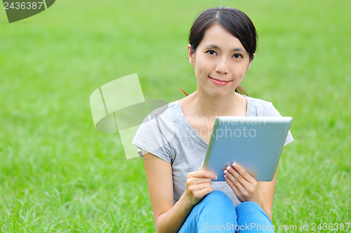 Image of Asian woman with digital tablet 