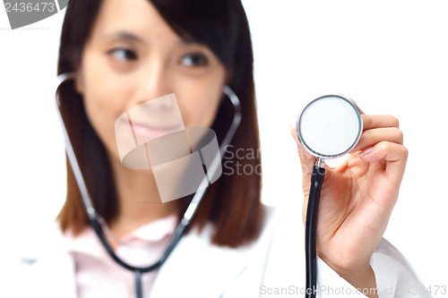 Image of Asian female doctor holding stethoscope