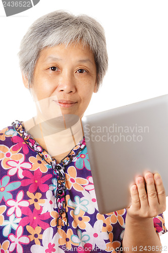 Image of Asian old woman with digital tablet