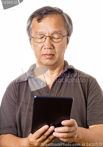 Image of Asian man using tablet