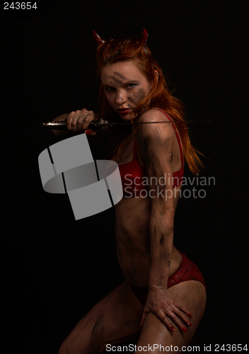 Image of dark red devil girl with a knife