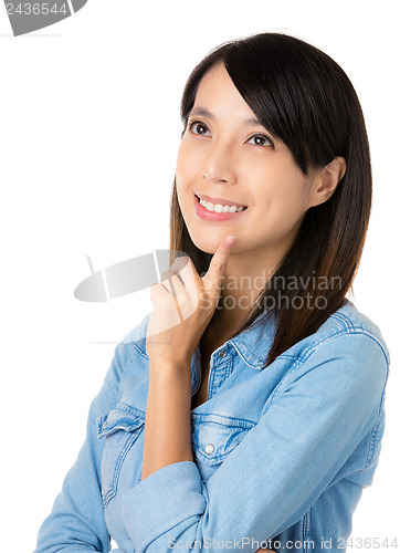Image of Asian thoughtful woman looking up