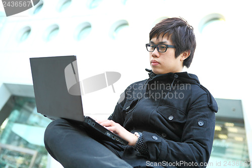 Image of man using laptop computer