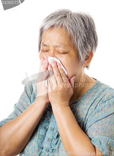 Image of Sneezing mature asian woman