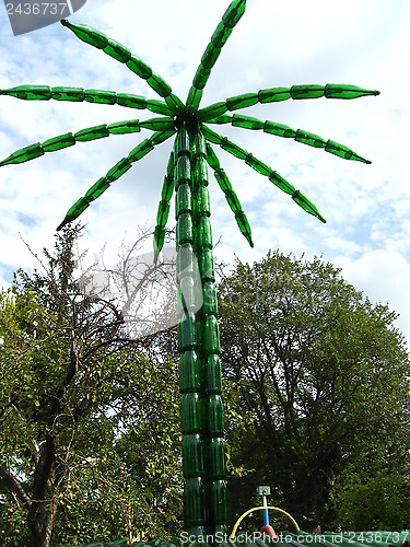 Image of Palm tree made of bottles from a champagne