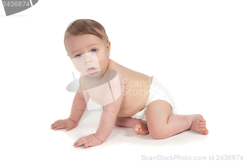 Image of Side view of beautiful crawling baby