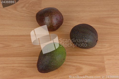 Image of Three ripe avocado.