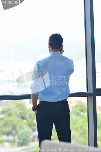 Image of business man talking by cellphone