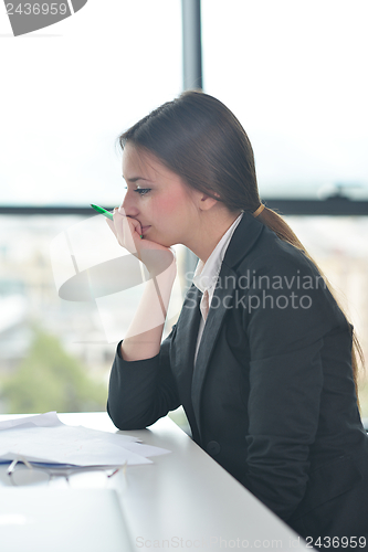 Image of tired  business woman at the office