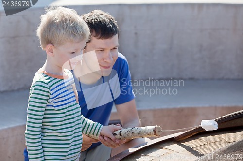 Image of family making marshmallows