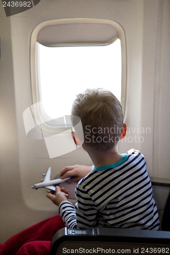 Image of boy in the plane