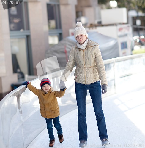 Image of family ice skating