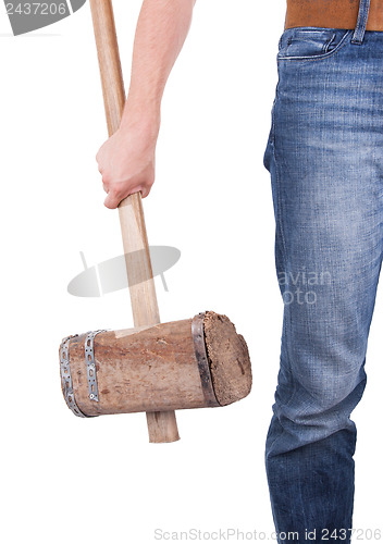 Image of Man with very old wooden hammer isolated 