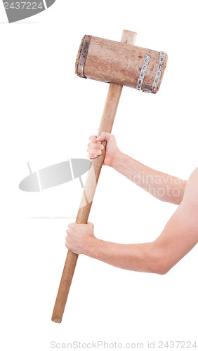 Image of Man with very old wooden hammer isolated 