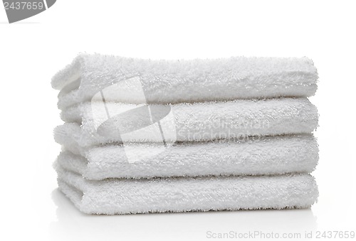 Image of Stack of white hotel towels on a white background