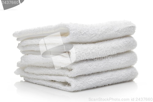 Image of Stack of white hotel towels on a white background