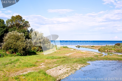 Image of river, coastline and blue sea 