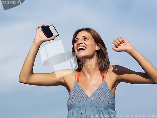 Image of beautiful woman with mobile h