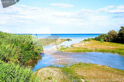 Image of river, coastline and blue sea 