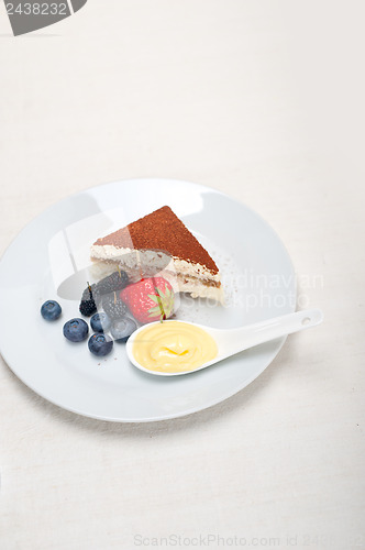 Image of tiramisu dessert with berries and cream