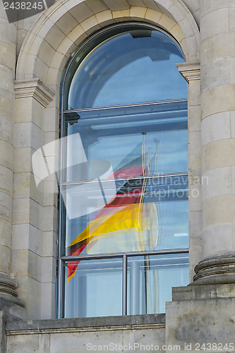 Image of Reflection of German flag in Reichstag window