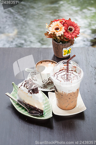 Image of Coffee latte and cheese cake in zen garden