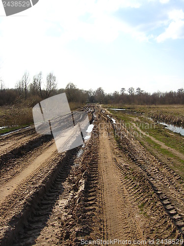 Image of Rural road with dirt and greater traces of cars