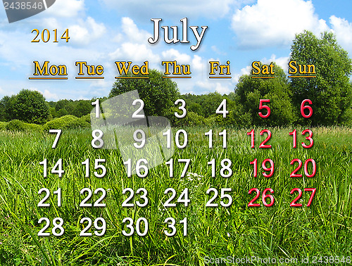 Image of calendar for July of 2014 on background of summer