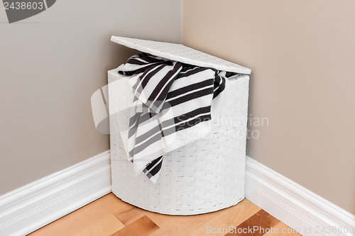 Image of Laundry basket in the room corner