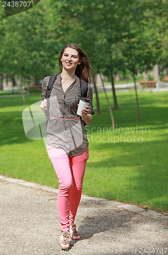 Image of Young Woman Running in a Park